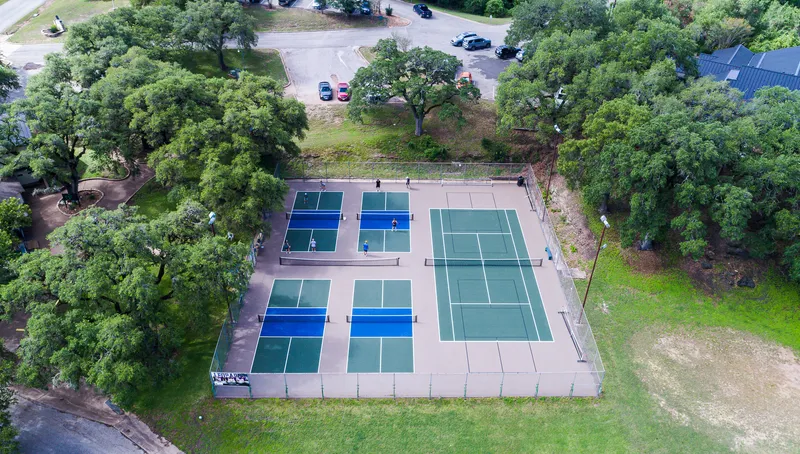 Country club tennis and pickleball courts photographed from above